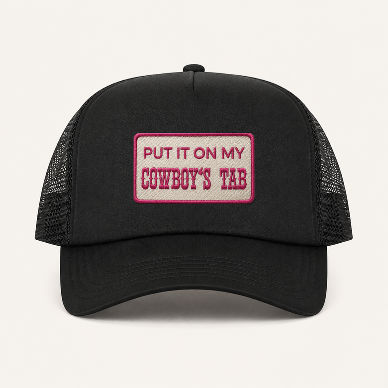 Black PUT IT ON MY COWBOY’S TAB trucker hat front view