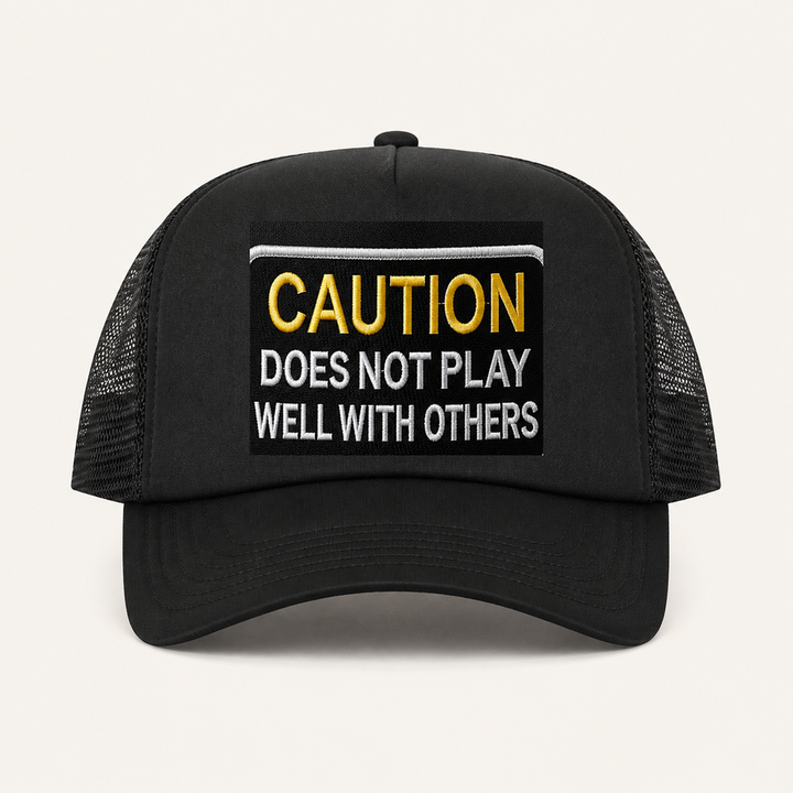 Black CAUTION: DOES NOT PLAY WELL WITH OTHERS trucker hat front view