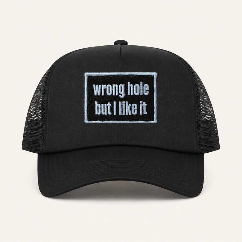 Black WRONG HOLE BUT I LIKE IT trucker hat front view